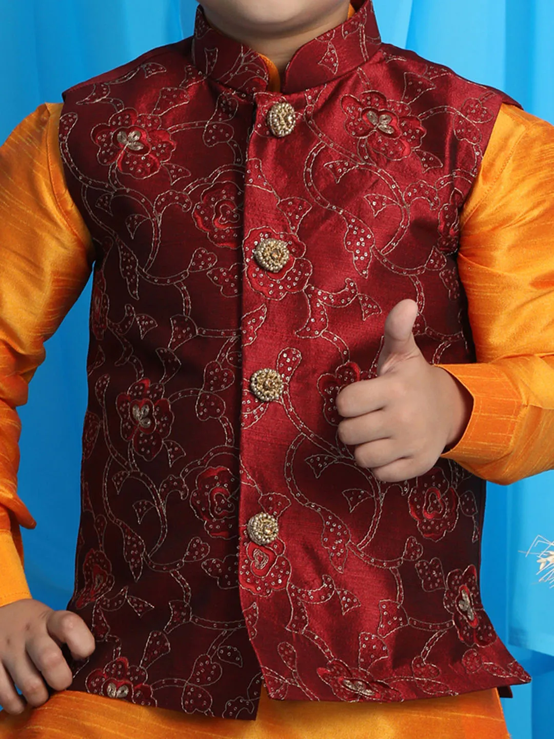 Vastramay Boy's Maroon Embroidered Nehru Jacket With Orange Kurta And Maroon Dhoti Set